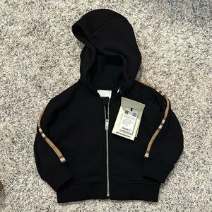 Never been worn Burberry baby sweatsuit jacket. Size 12M